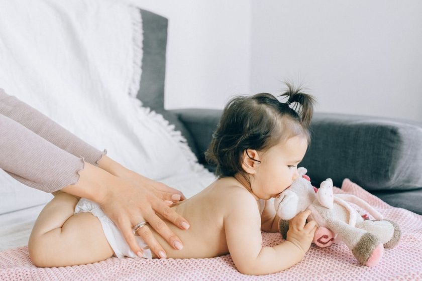Baby being gently massaged
