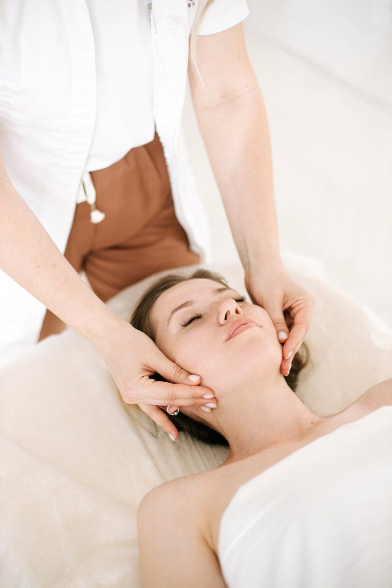 Woman getting neck massaged